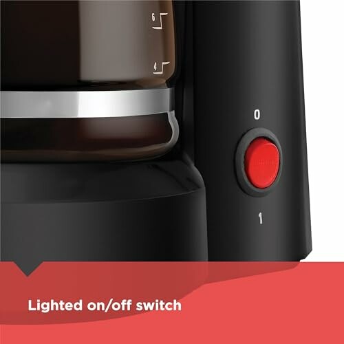 Close-up of coffee maker with lighted on/off switch